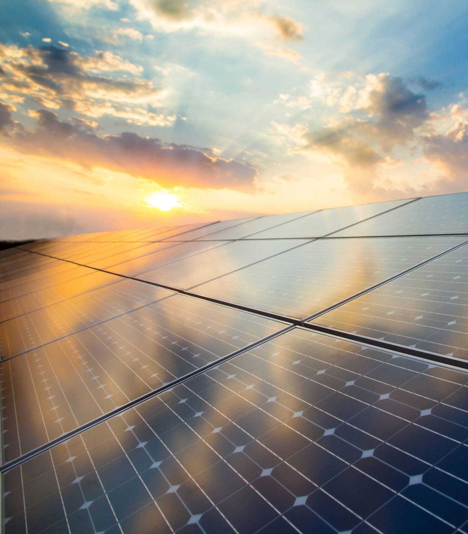 Photovoltaic modules on the background of sunset and cloudy sky Photovoltaic modules on the background of sunset and cloudy sky